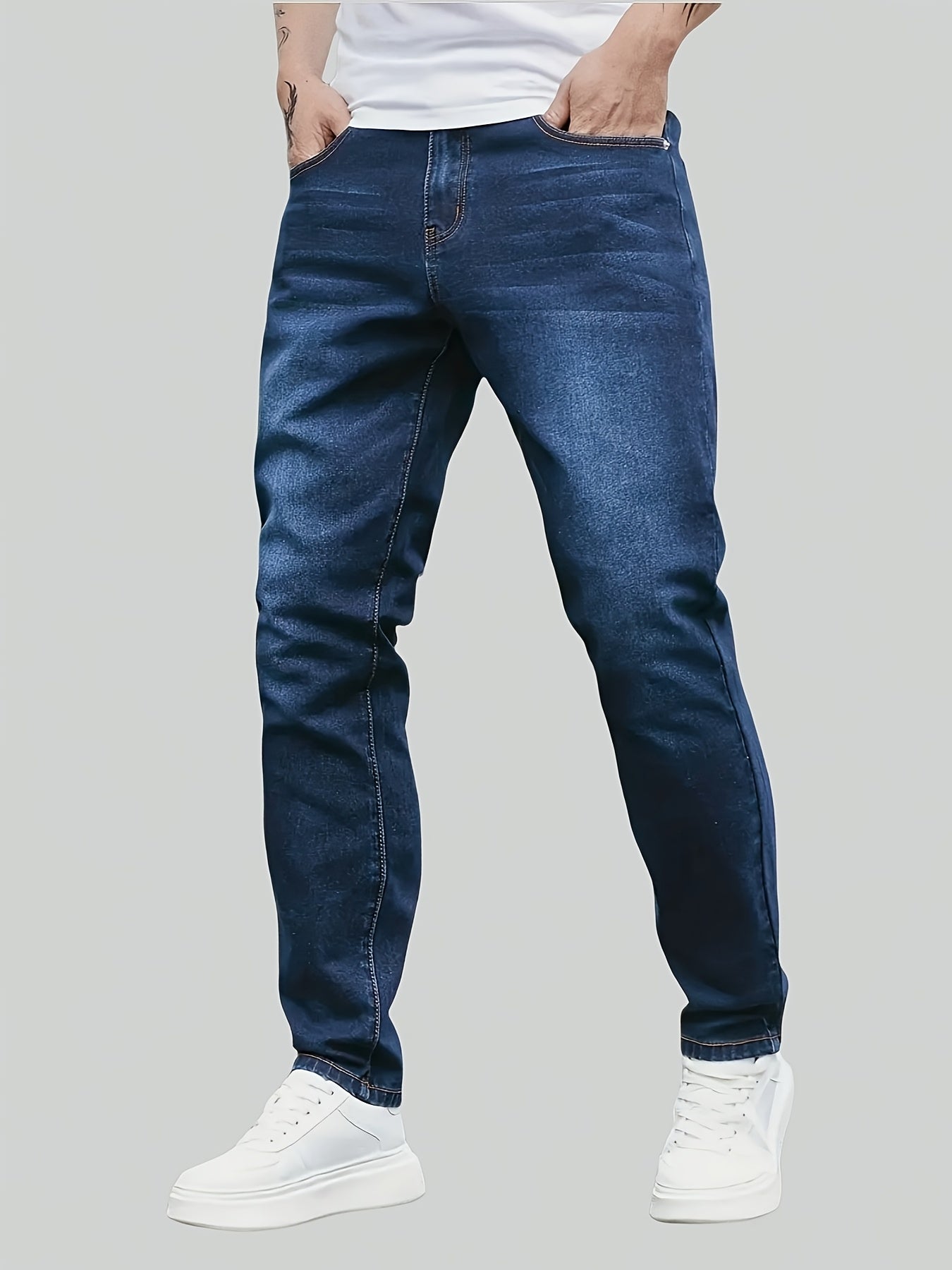 Men's denim jeans in plus size with a straight leg cut, made of 65% cotton, 33.7% polyester, and 1.3% spandex. Features medium stretch, all-season comfort, solid washed style, and 370gsm