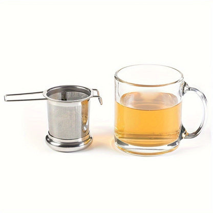 Tea infuser made of durable stainless steel for loose leaf tea, with lid and handle for convenient use at home, office, restaurant, or hotel. Features micropore metal strainer basket.