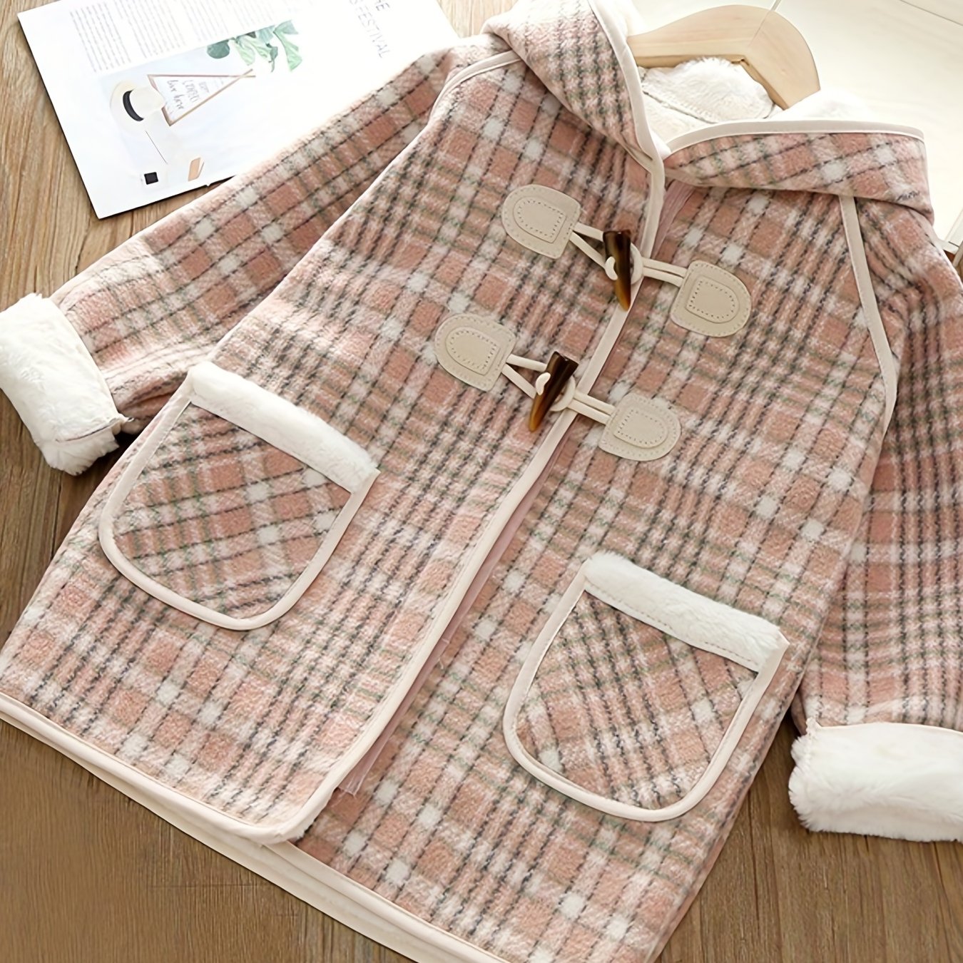 Girls' winter fleece plaid toggle coat with hood and pockets for a stylish outdoor look.