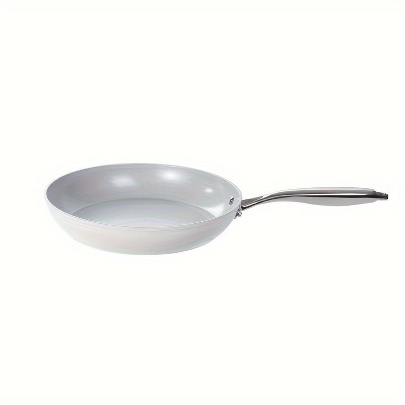 White wok pressure-proof ceramic frying pan suitable for egg steak cooking available for use on gas stove or magnetic stove. This versatile cookware is dishwasher safe and perfect for all your kitchen needs.