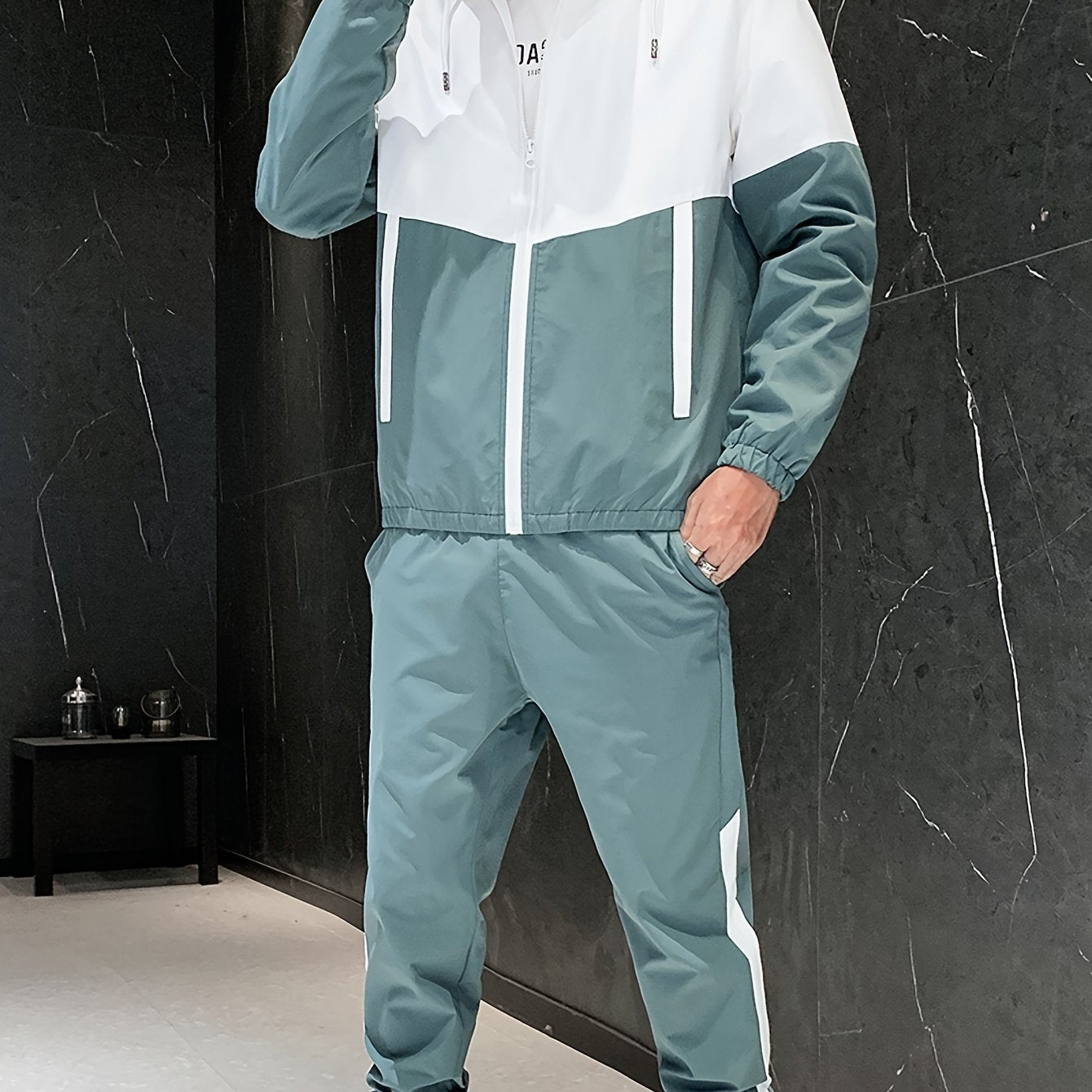 Men's casual sporty green and white zip-up hooded jacket and pants set made of durable woven polyester. Machine washable with pockets, perfect for running, golf, hiking in the spring and