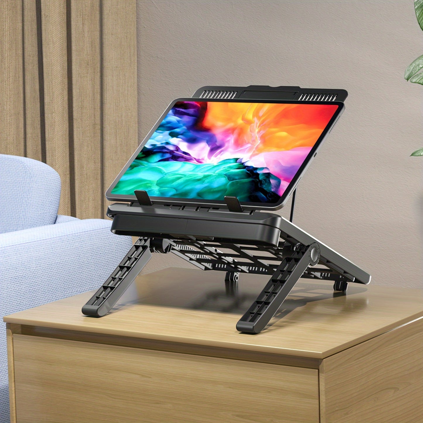 Adjustable laptop stand for 43.94cm laptops with phone holder, durable ABS material, ergonomic design, sturdy metal frame.