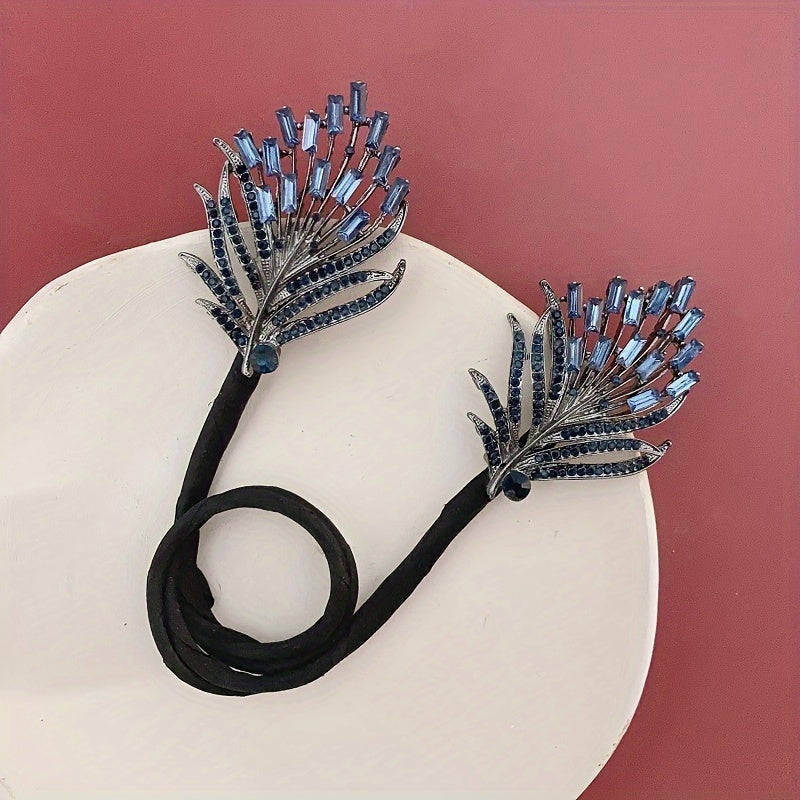 Feathered twist hair clip adorned with rhinestones