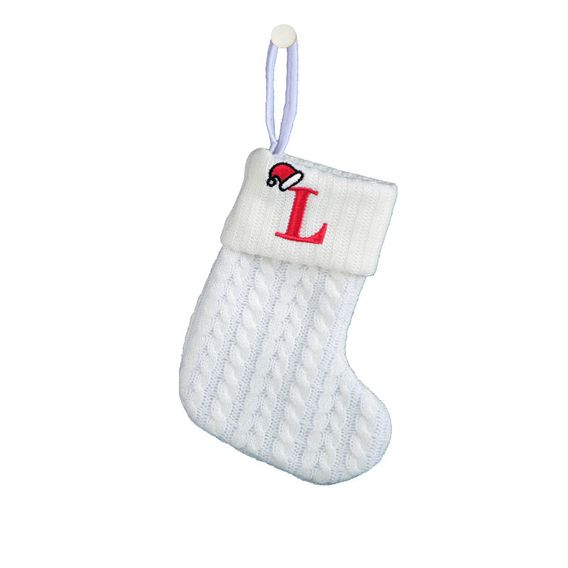 White cable knit stocking with embroidered 'F' - Ideal for indoor decor.