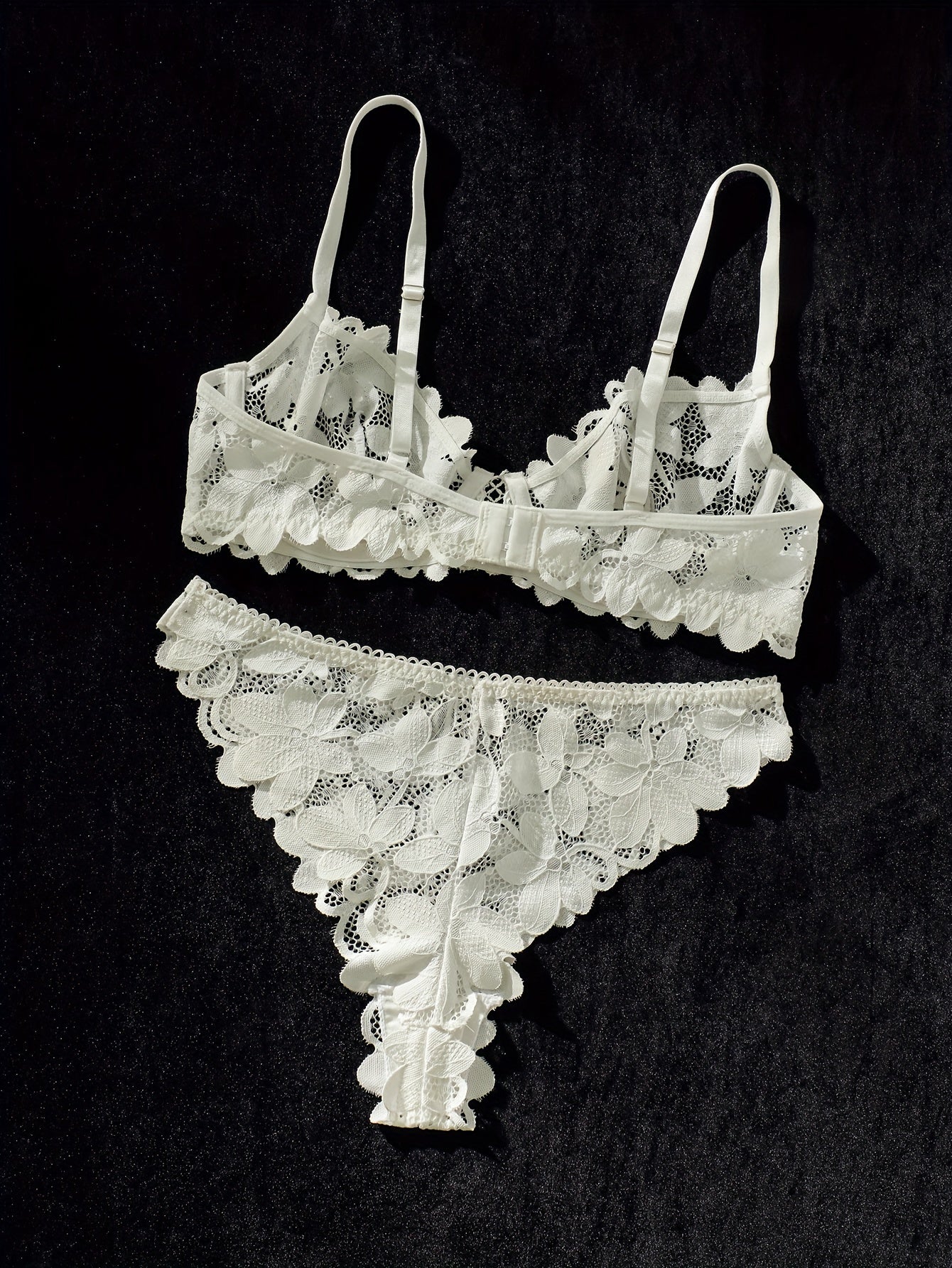 Sexy lace lingerie set with flower pattern, spaghetti straps, and matching bra and panty.