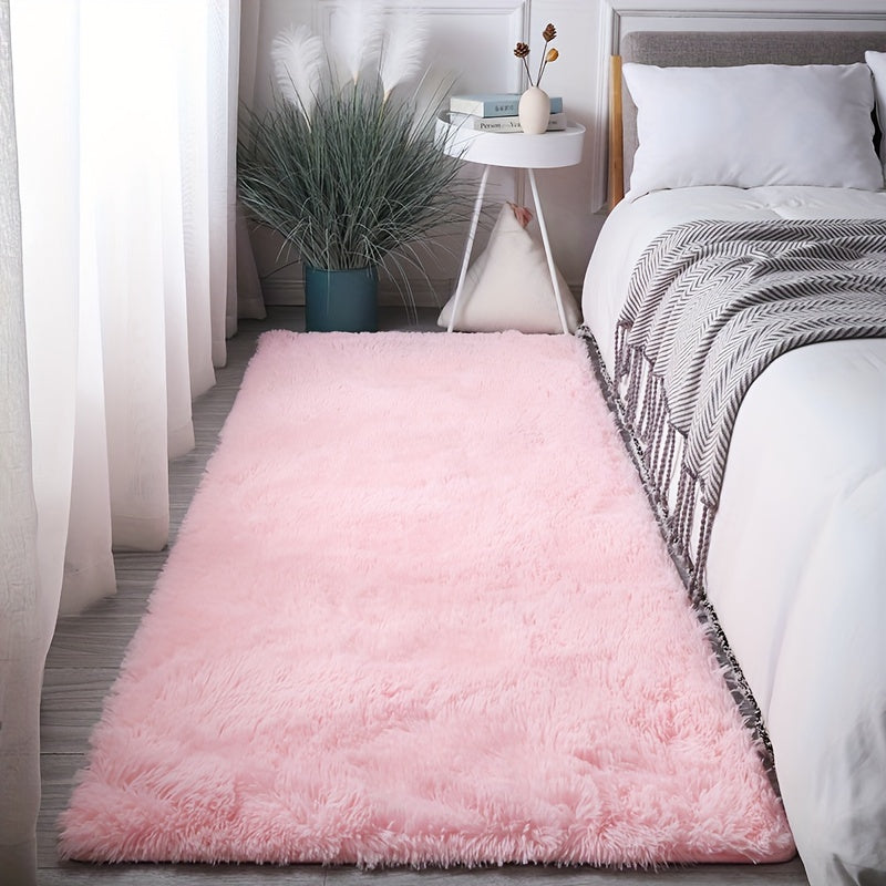 Soft and fluffy pink area rug, machine washable with a shaggy design. Perfect for adding a cozy touch to any living room, nursery, or dorm room. Non-slip and aesthetically pleasing.