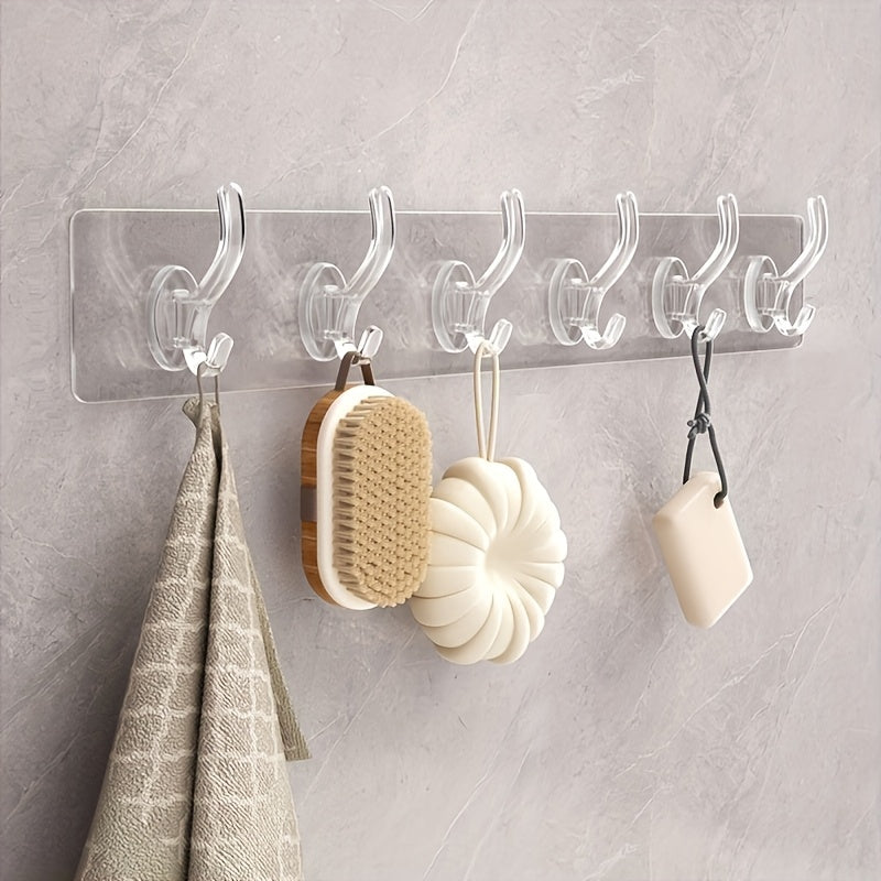 Contemporary transparent waterproof adhesive hooks that require no drilling for easy wall mounting. Ideal for storing clothes, hats, towels, and accessories in the bathroom, wardrobe, or bedroom.