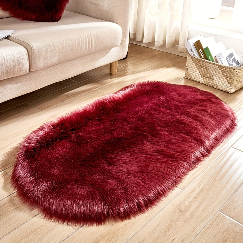 Soft and plush faux sheepskin oval area rug, perfect for adding a cozy touch to any living room or bedroom. Machine washable and designed to be used as a bedside rug. This shaggy plush carpet will enhance your home decor and add a touch of luxury to any