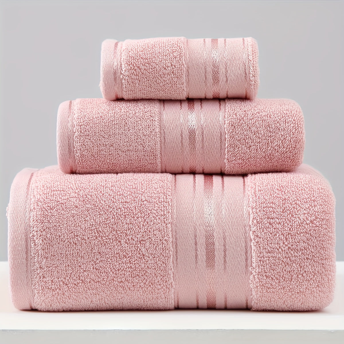 3-piece cotton towel set includes a washcloth, hand towel, and bath towel. Absorbent, quick-drying, super soft, and skin-friendly. Ideal for home bathroom use.