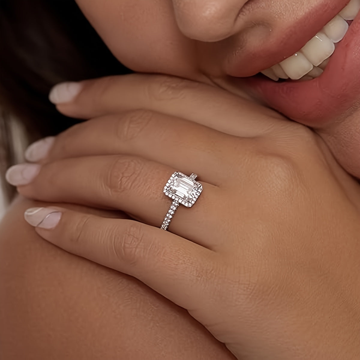 Graceful 925 Sterling Silver Plated Moissanite Engagement Ring for Women, Featuring a Stunning 2 Carat Emerald Cut Stone, a Promise Ring Symbolizing Eternal Love. Crafted with Hypoallergenic Materials, this Wedding Band Comes with a Certificate and