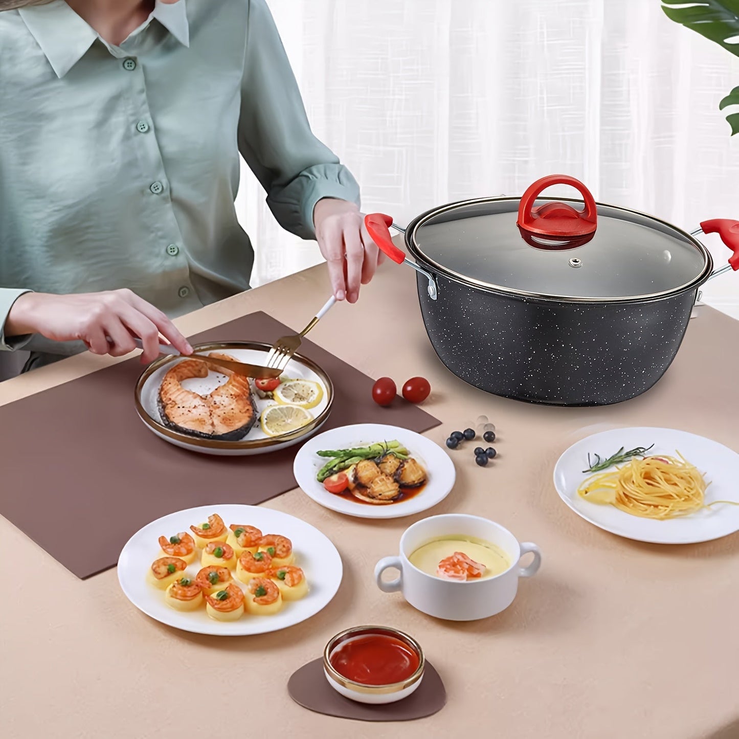 Multi-functional soup pot with a non-stick coating and matching lid, ideal for cooking stews, hot pots, and noodles. Can be used on gas and induction stoves. Features a timeless red and black design.