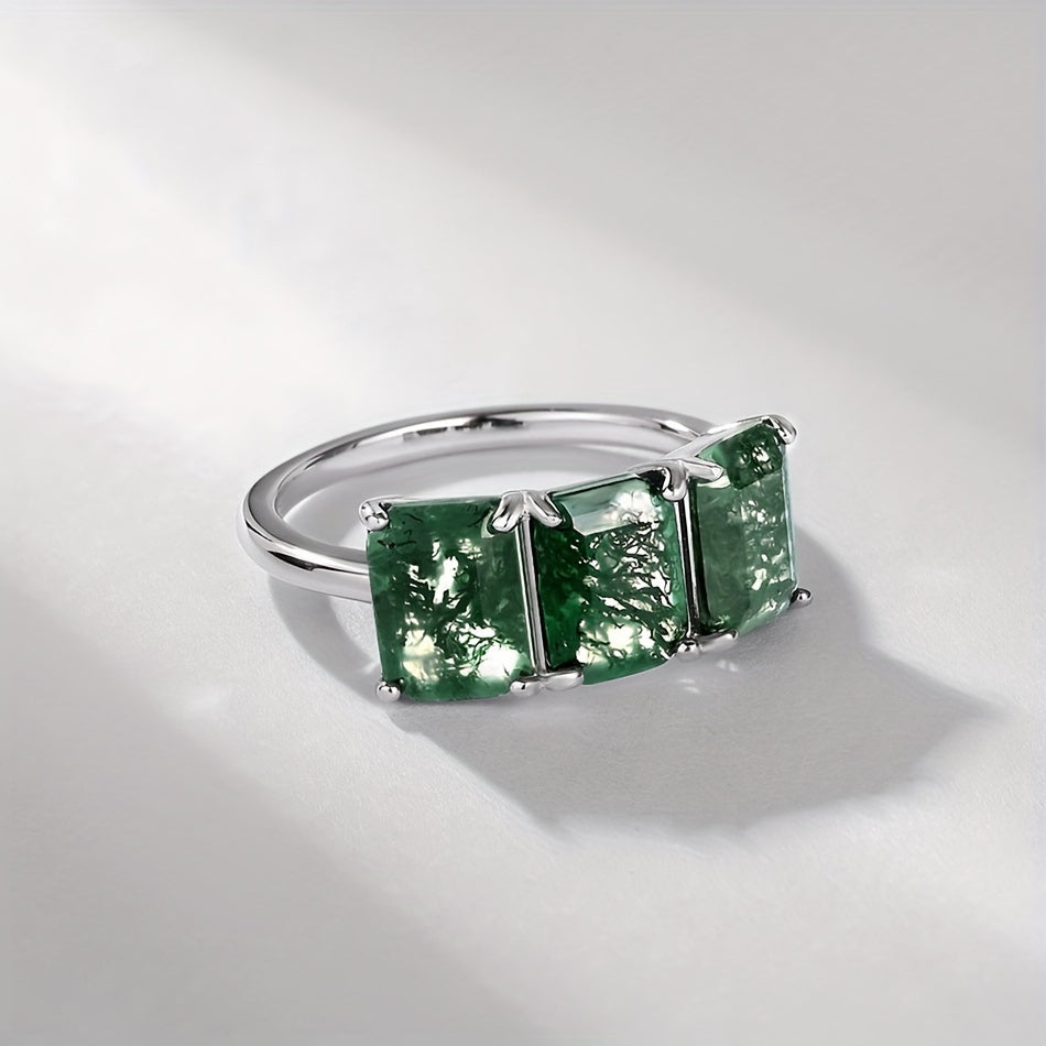 Handcrafted with elegance, the ALLNOEL Simple 925 Sterling Silver Ring features a natural Moss Agate gemstone in a square 6*8mm cut, making it the perfect June birthstone for daily wear or special occasions. This piece exudes sophistication and charm