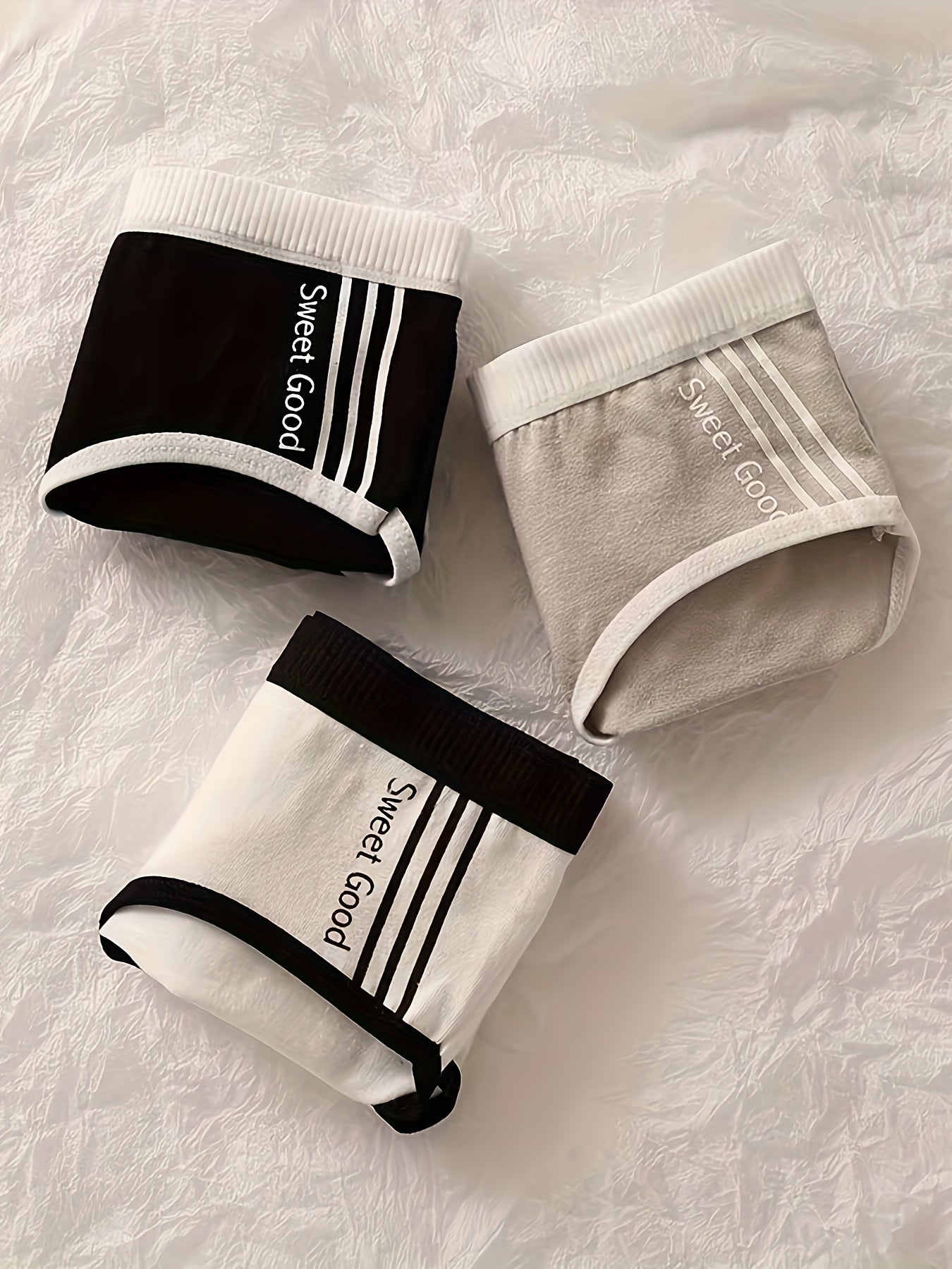 3 pieces of letter graphic briefs with breathable and comfy contrast binding, perfect for women's lingerie and underwear.