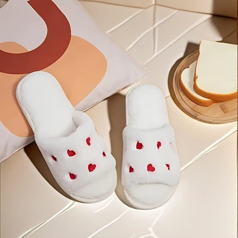 Heart-shaped plush slippers with soft soles, perfect for Valentine's Day in the bedroom.