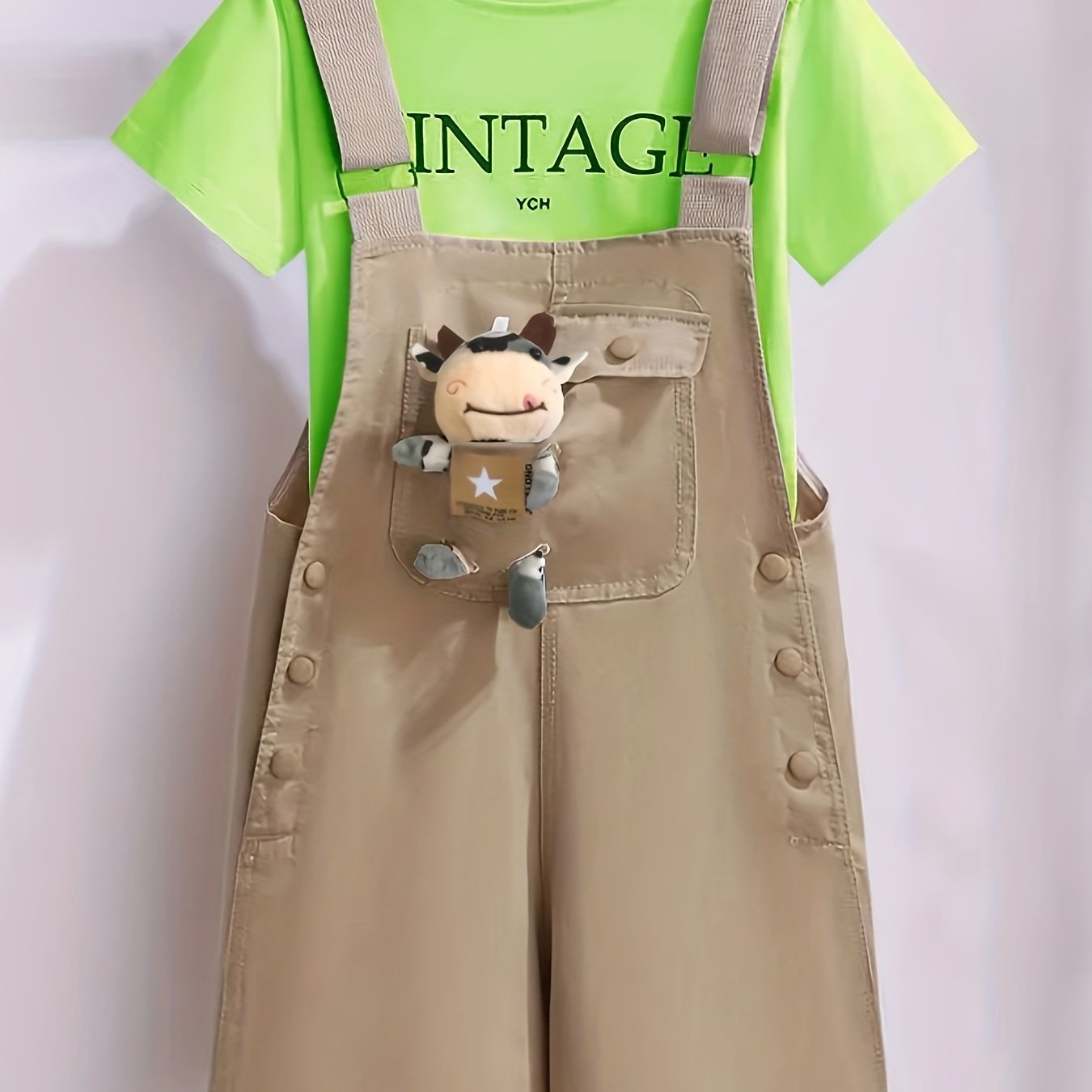 Girls' summer outfit with trendy suspenders and lightweight overalls for outdoor wear.