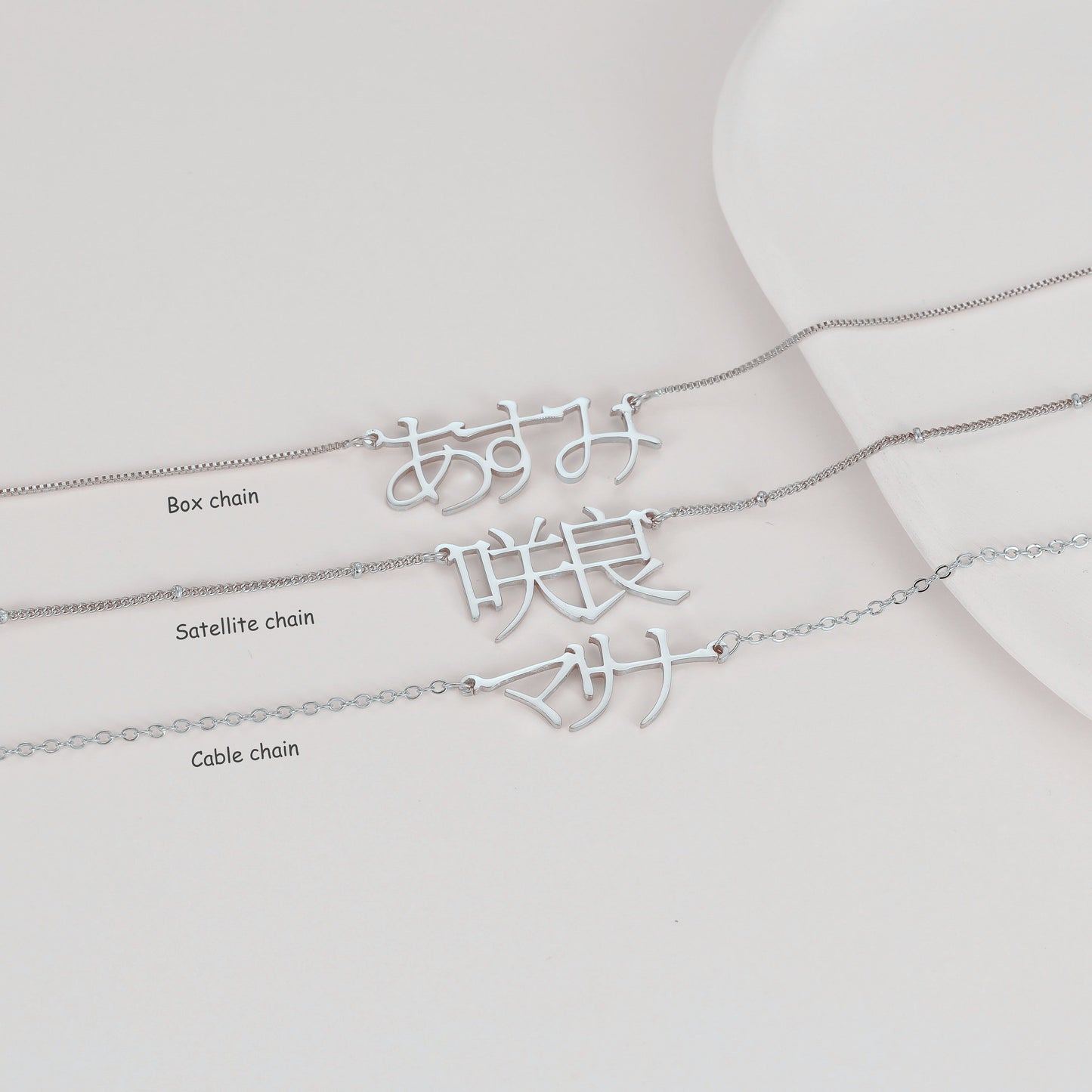 A unique Japanese Kanji name necklace made of stainless steel, featuring custom Katakana and Hiragana pendant. The perfect gift for your mom, sister, or best friend.