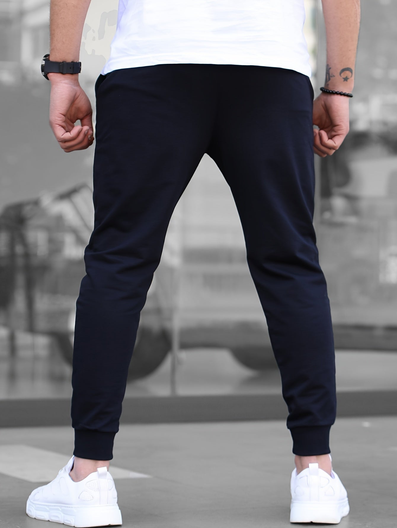 Solid color jogger pants for men with drawstrings, lightweight and breathable for running and fitness.