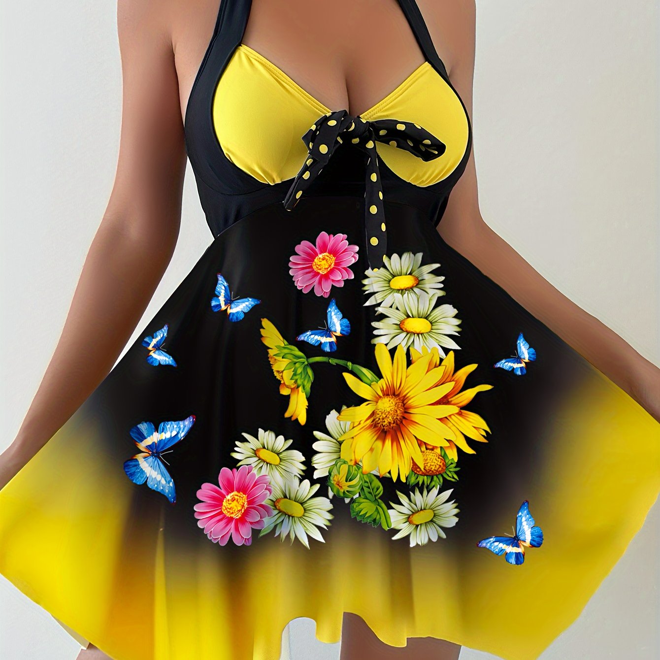 Women's 2 piece tankini set with sunflower print top, bow swim dress, and dot print bottoms.