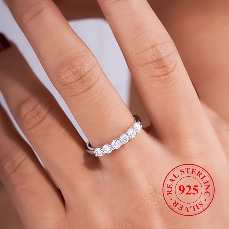 High quality gift for a special person, this 925 Sterling Silver Eternity Ring features a line of sparkling zirconia, perfect for engagement or wedding.