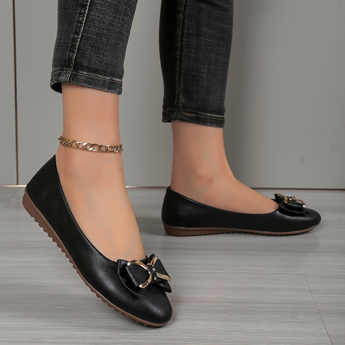 Casual flats for women with bow and rhinestone detail, round toe comfort, slip-on style, solid color.