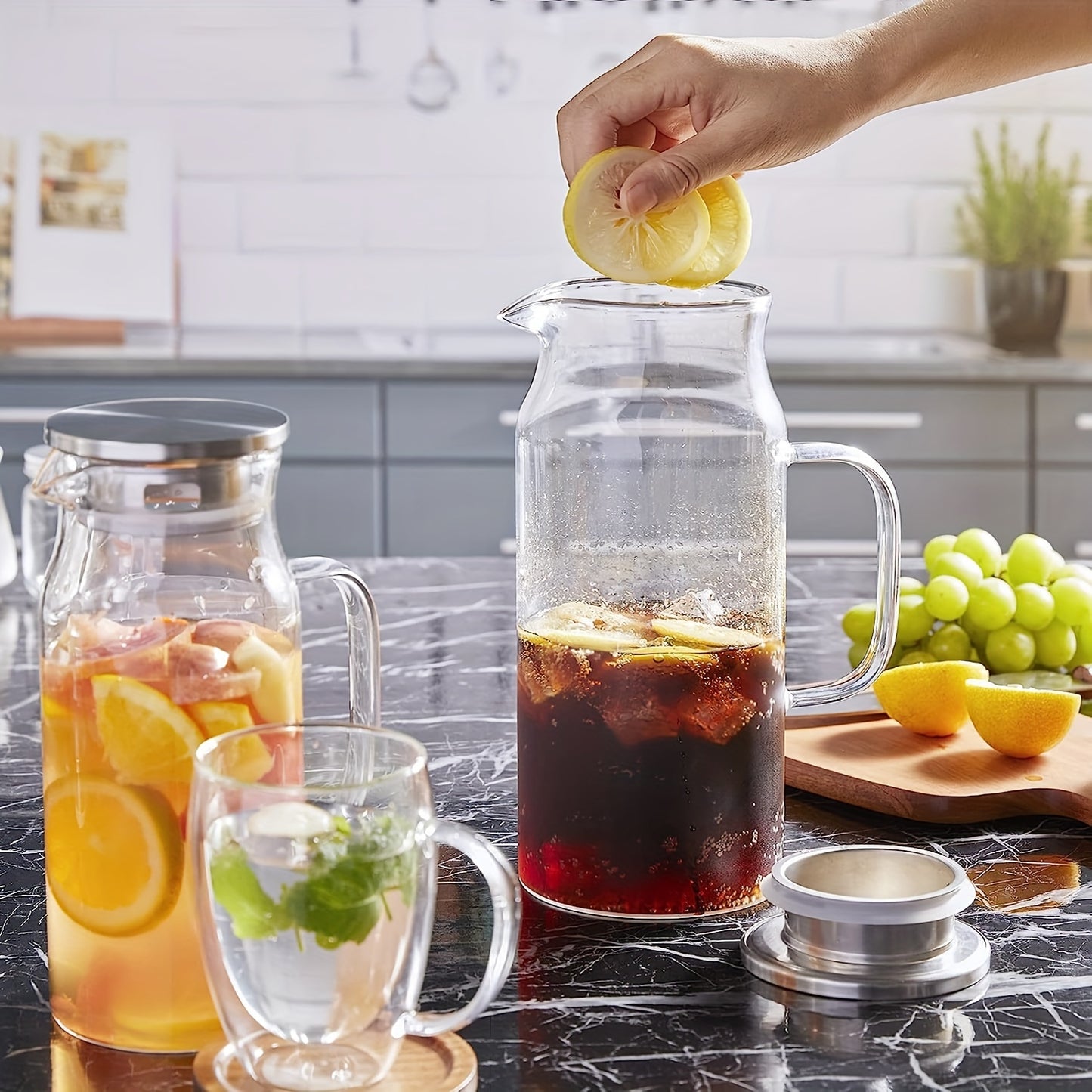 Large glass pitcher with lid and spout, perfect for hot/cold beverages like coffee, juice, and homemade drinks. Great holiday gift for friends, kitchen accessory.