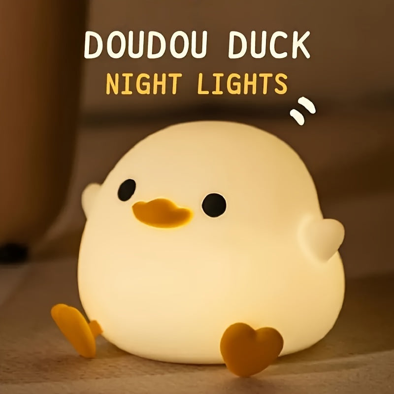 A whimsical Cute Duck-Shaped Table Lamp with a Geometric Pattern and White Matte Finish. This battery-powered lamp includes a switch, a plastic shade, and a G13 bulb base for ≤36V. Perfect for bedside reading or as a nursery night light, providing gentle