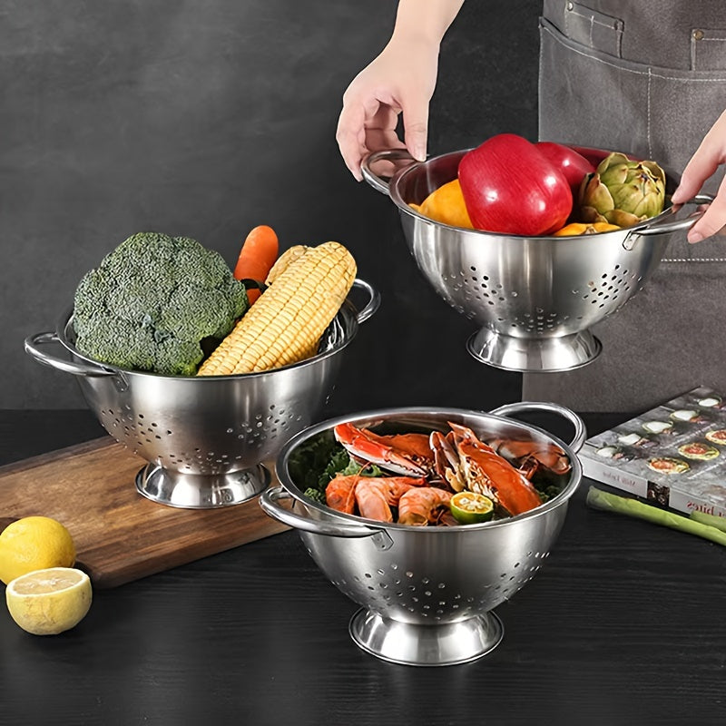 One piece of a durable metal colander with handles, perfect for washing and draining vegetables, fruits, and pasta. This food-safe kitchen strainer is made of stainless steel and comes with a sturdy base.