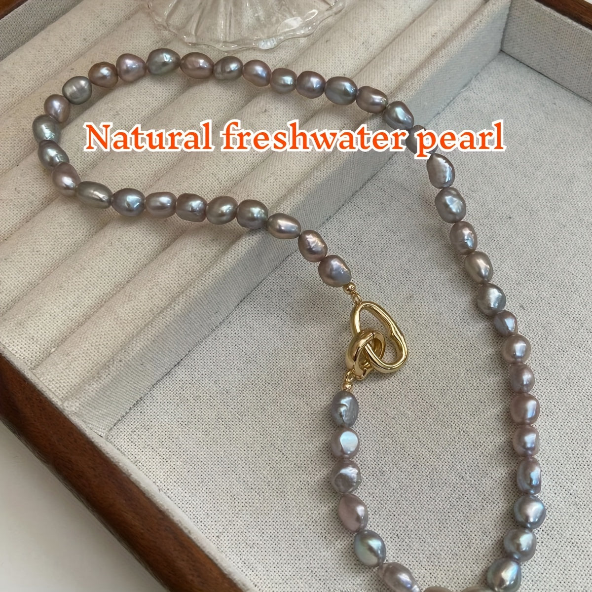 Beautiful French-inspired freshwater pearl necklace featuring distinctive gray baroque pearls, perfect for adding a touch of elegance to any outfit. Whether paired with casual attire or worn for a special occasion, this necklace is versatile and chic