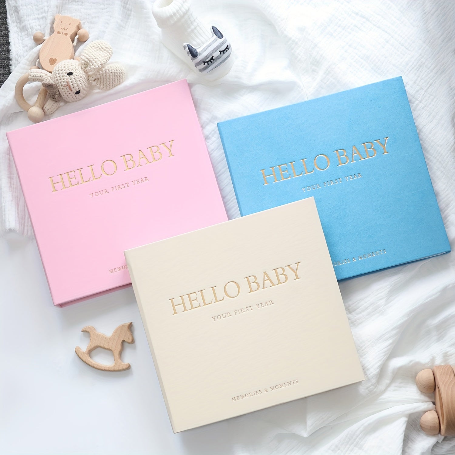 Linen memory book with golden logo, spiral bound journal with 86 pages, includes 12 monthly milestone stickers for youngsters. Ideal gift for baby showers or pregnancy.