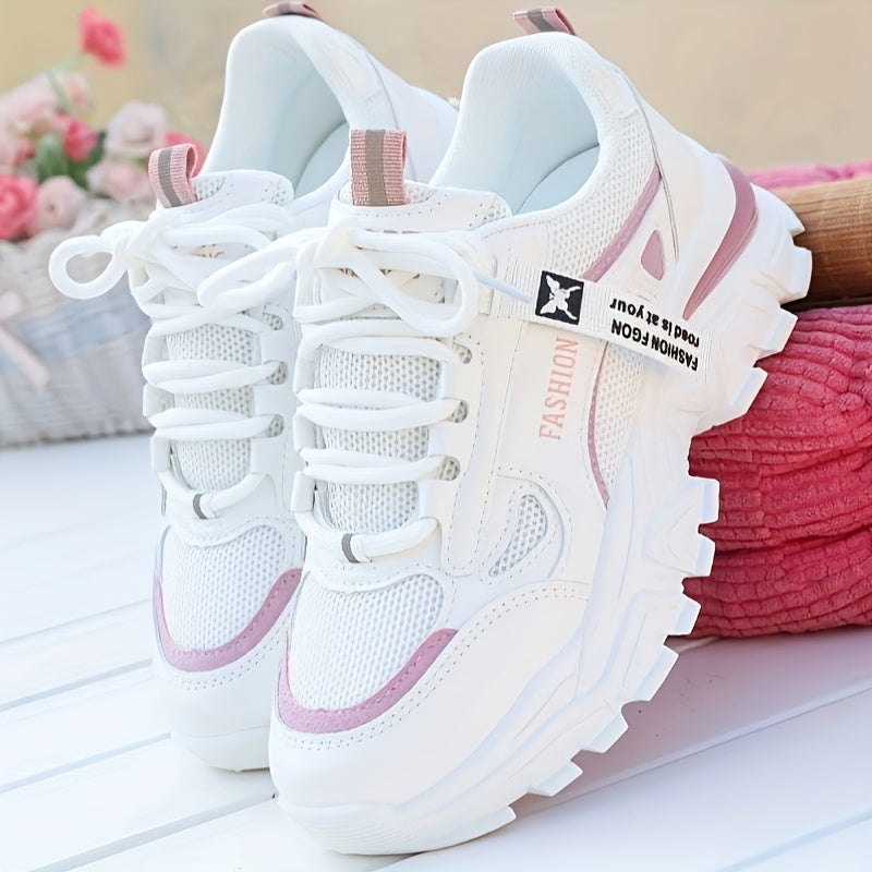 Women's white sneakers with low top lace-up, mesh upper, breathable fabric insole, and durable PVC sole for casual and sporty wear. Casual and trendy footwear.