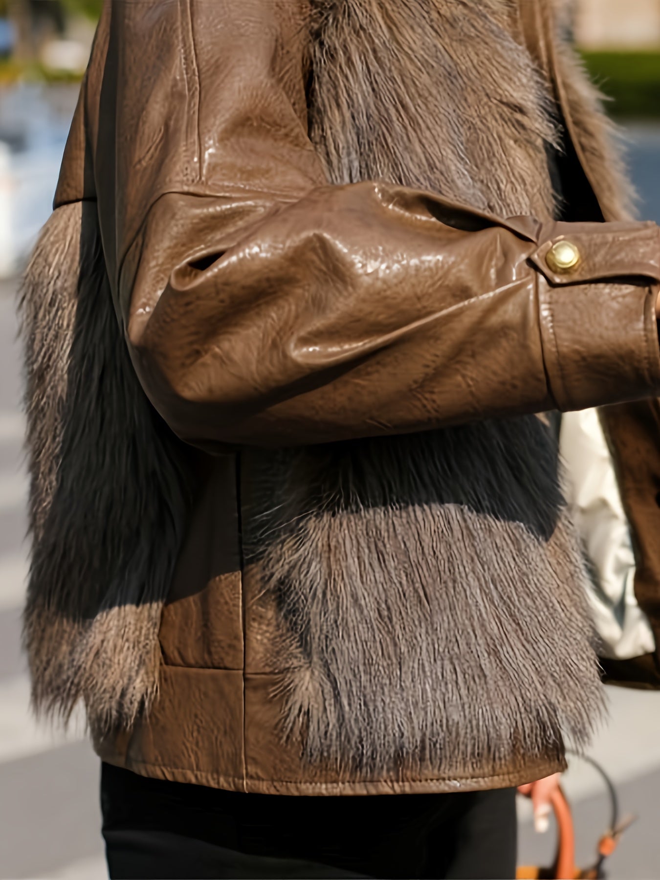 Women's faux fur-trimmed jacket with soft texture, button front, long sleeves, and side pockets for cozy comfort.