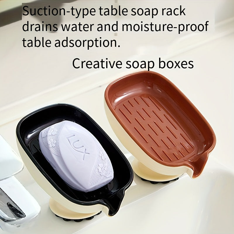 Durable plastic oval soap dish with an elegant, self-draining design for bathroom use.