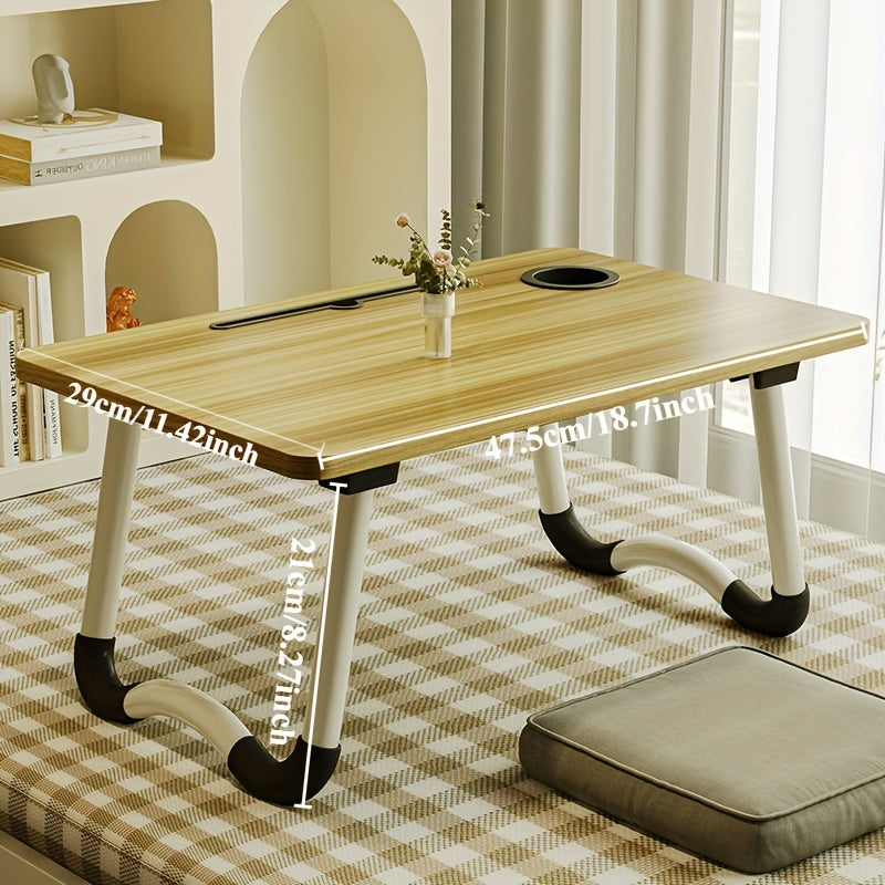 Foldable laptop desk with sturdy material and spacious desktop, suitable for student dorms.