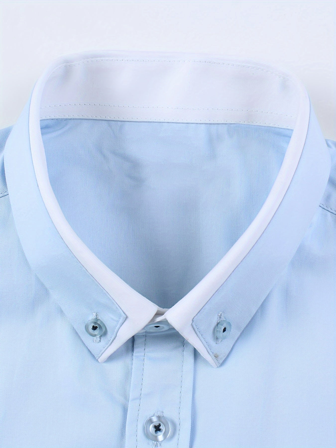 Long sleeve men's dress shirts with contrast lapel collar design, suitable for formal occasions.