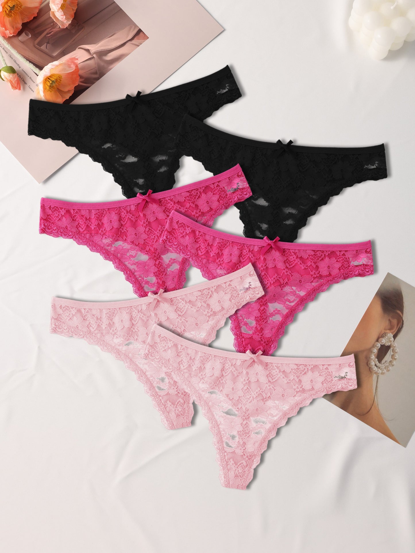 Six elegant floral lace women's thongs in black, pink, and white, with a sexy low-rise, stretch fit. Made from a breathable nylon blend with delicate lace detailing.