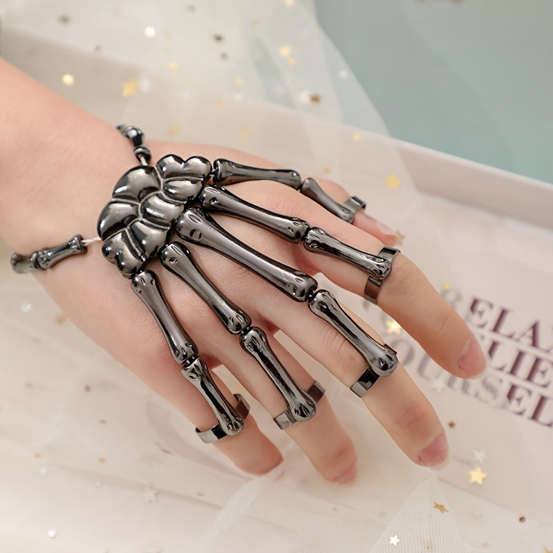 One piece of fashionable punk skull hand bone versatile five-finger adjustable stretch ring bracelet with a chain, embodying gothic and punk styles.