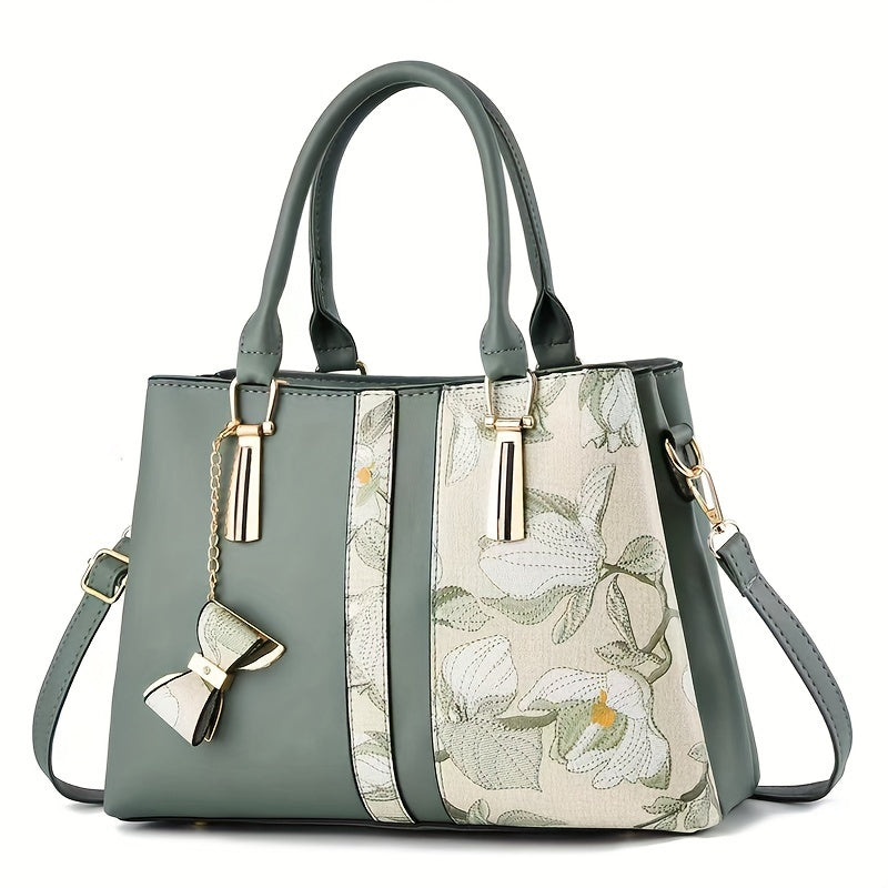 Chic floral print handbag with a spacious crossbody design.