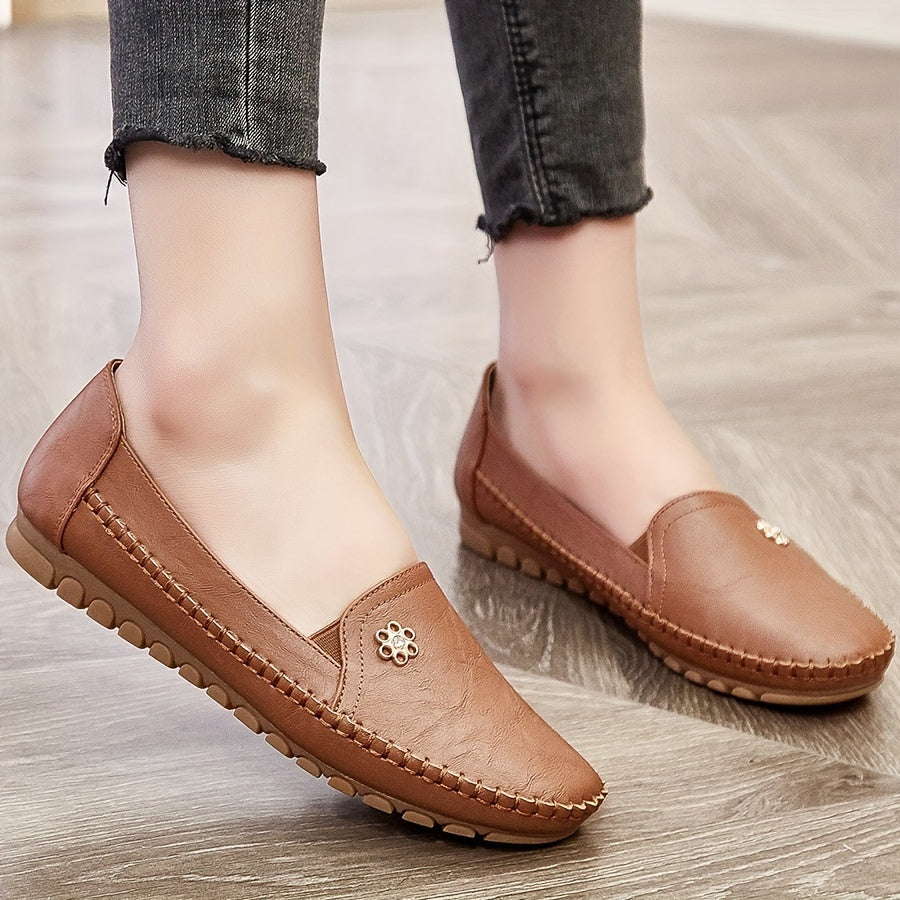 Stylish, comfortable women's loafers with flower buckle detail and soft sole for daily wear.