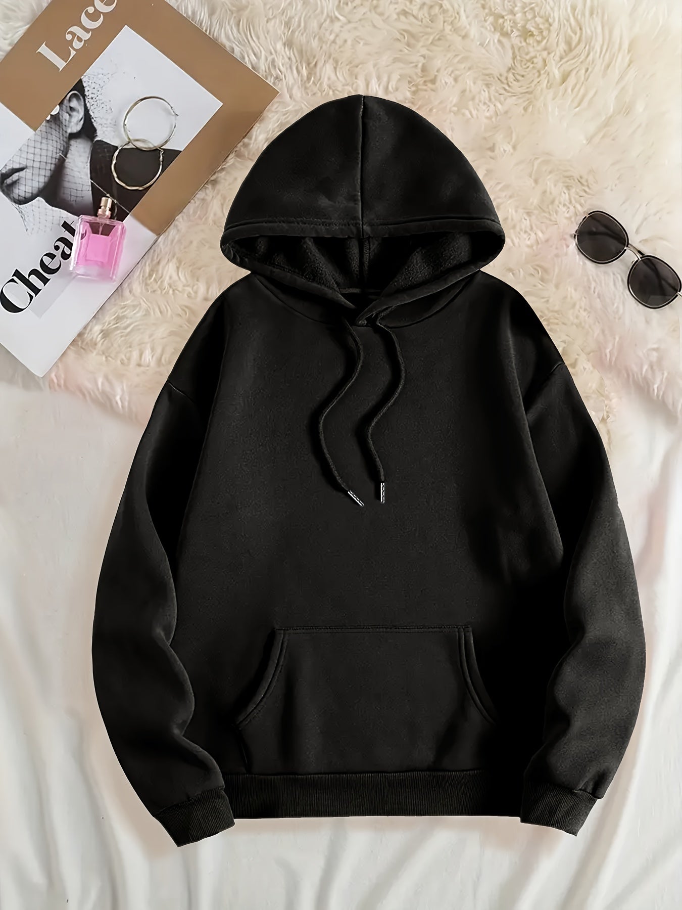 Women's polyester hoodie with knit fabric and slight stretch, fleece-lined hood with printed lettering and pockets.