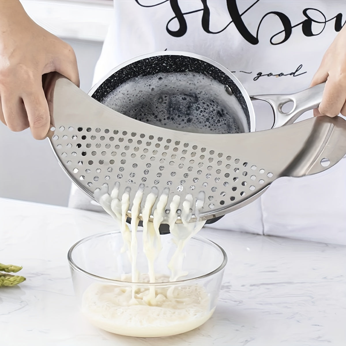 A kitchen filter made of stainless steel, designed for washing vegetables, filtering water, separating liquids, and draining excess water.