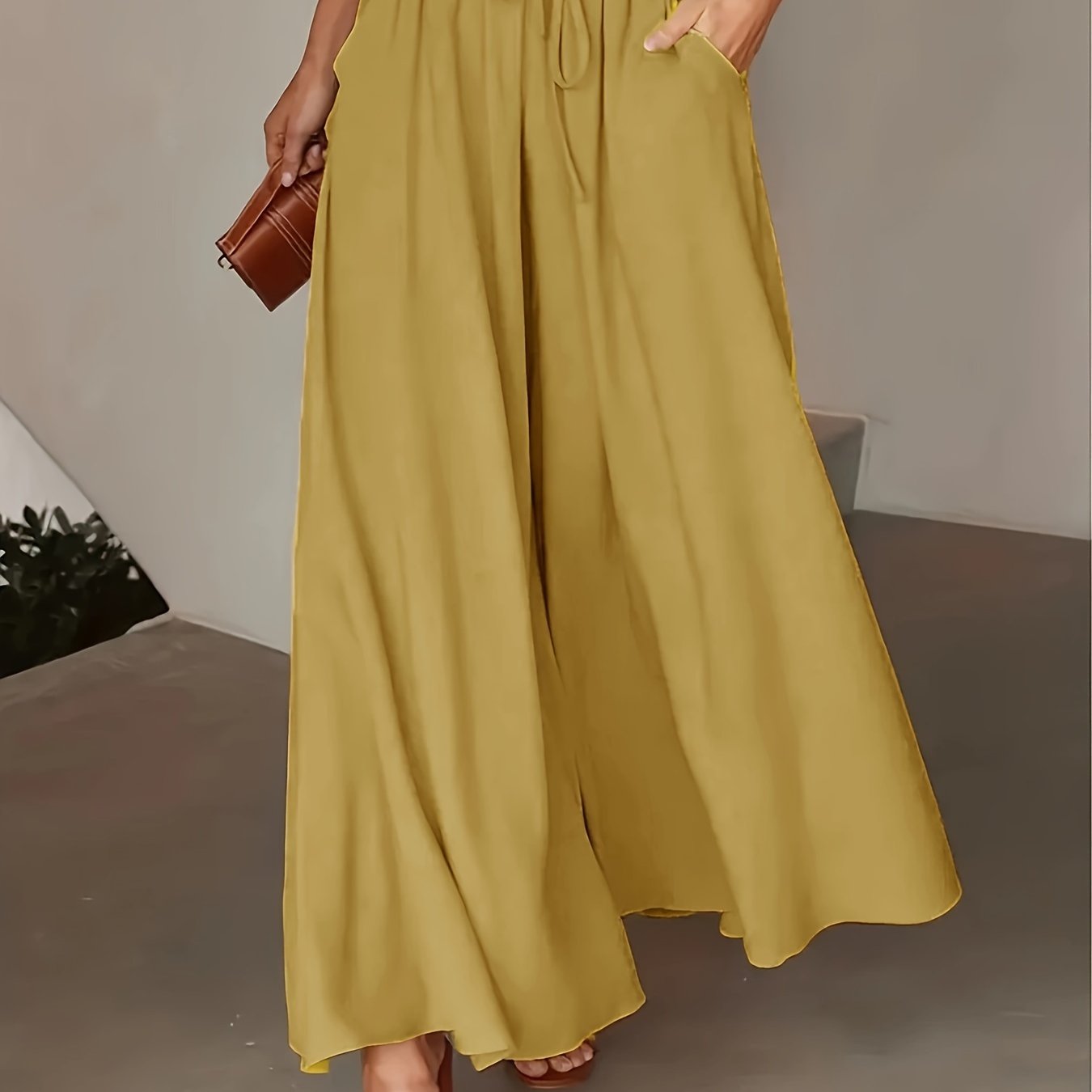 Spring/summer wide-leg pants with elastic waist and tie, for casual wear by women.