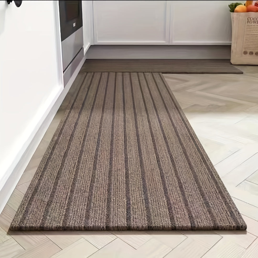 One piece of rectangular kitchen carpet measuring 1.8m x 0.9m. Features include non-slip, oil resistant, waterproof, and easy to maintain polyester fiber material with low pile. The carpet is machine washable and has a striped pattern, making it a