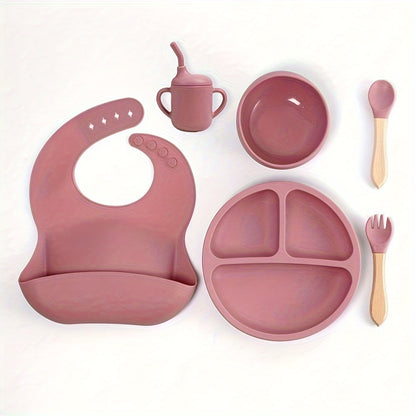 6-piece silicone feeding set with strong suction includes divided plate, wooden spoon and fork, microwave safe - great for self-feeding.