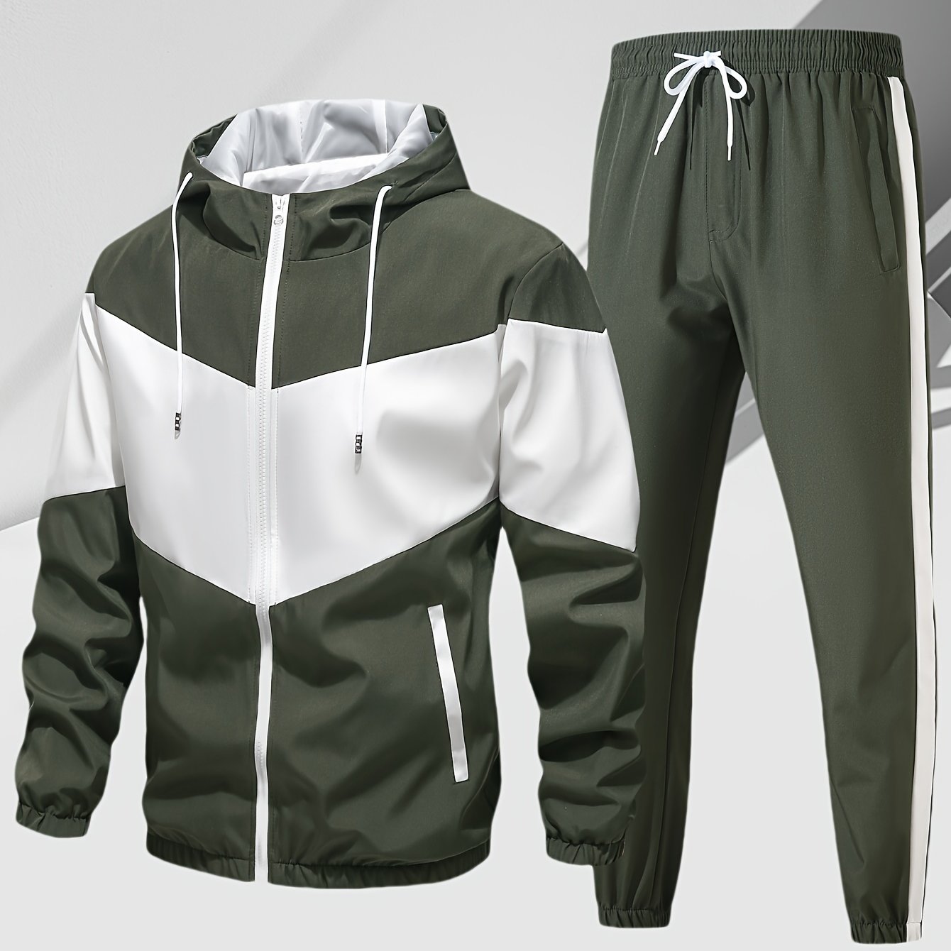 Men's casual 2-piece outfit with a stylish color block zip up hooded jacket and breathable drawstring pants.