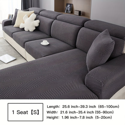 Waterproof sofa cover with elastic stretch and jacquard argyle pattern for home or office decor.