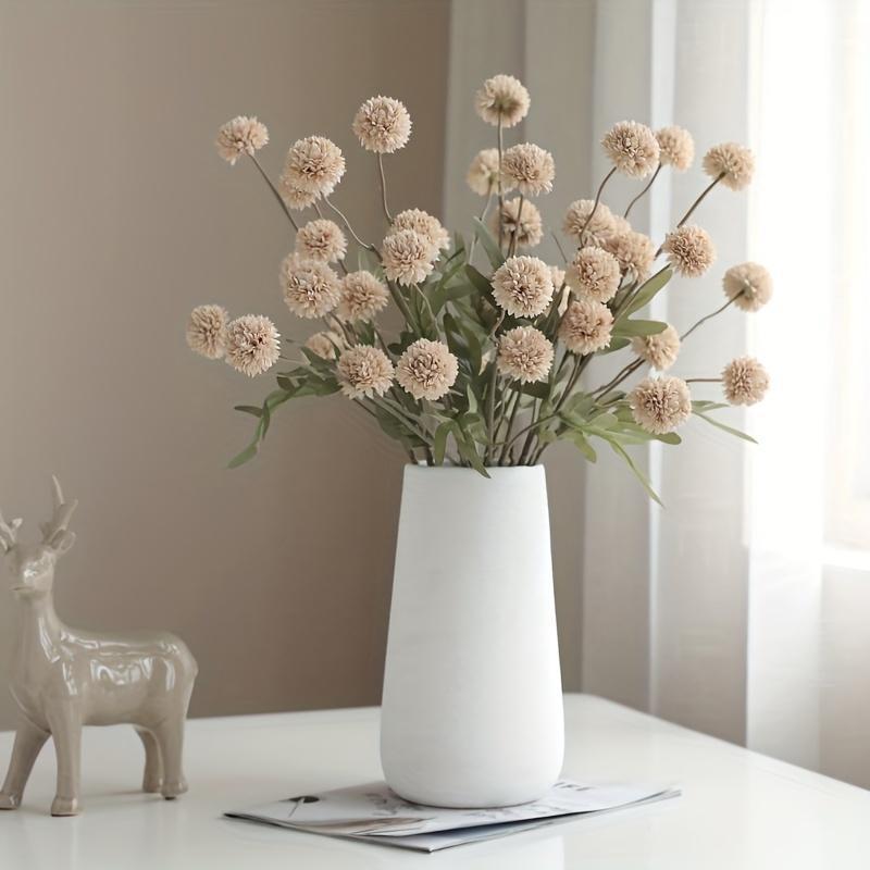 Simulated European-style dandelion decoration with artificial flowers in various styles.