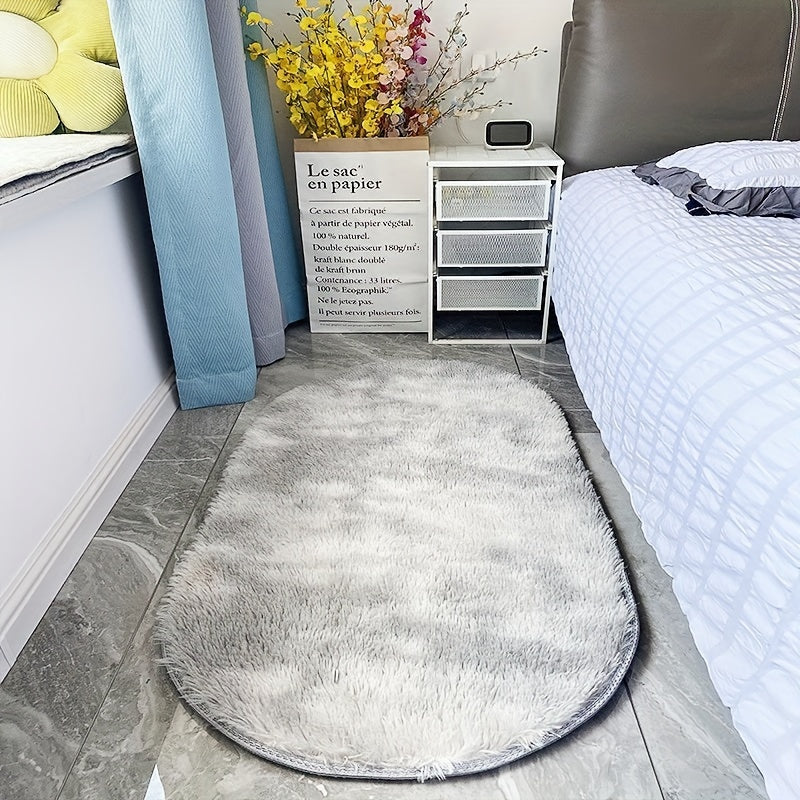 Soft and fluffy oval area rug, designed for use in living rooms, bedrooms, game rooms, and dormitories. Made of non-slip, washable polyester material. Machine-made shaggy rug perfect for adding a cozy touch to your space. Ideal for use as a bedside