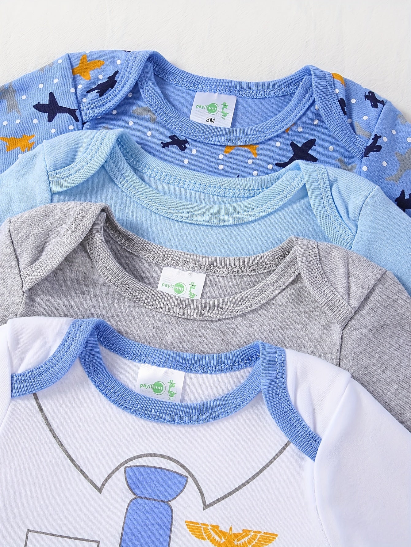 Boys' 4-pack long sleeve cotton onesies with astronaut and space patterns, perfect for fall/winter. Made with knit fabric for a regular fit and slight stretch. Suitable for outdoor wear for