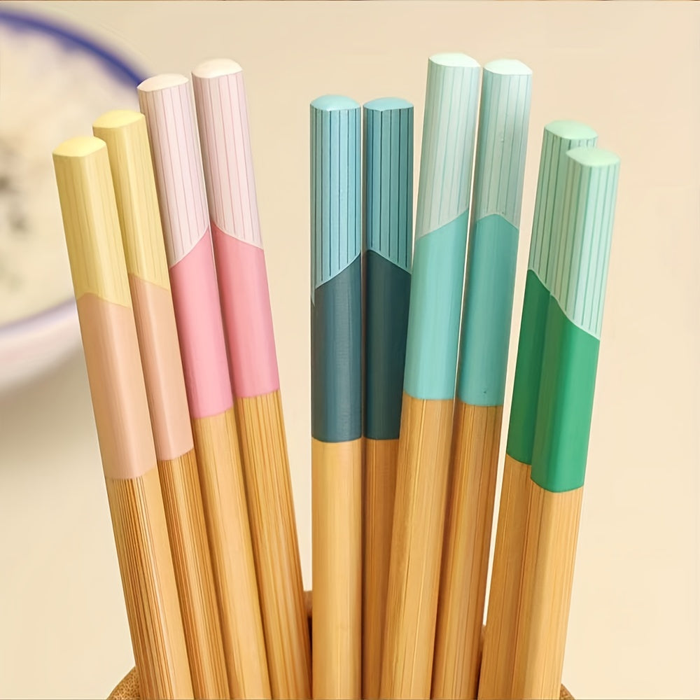 5 pairs of bamboo chopsticks that are antibacterial, anti-mold, anti-slip, carbonized, and high-temperature resistant. They are also reusable, lightweight, dishwasher safe kitchen supplies.