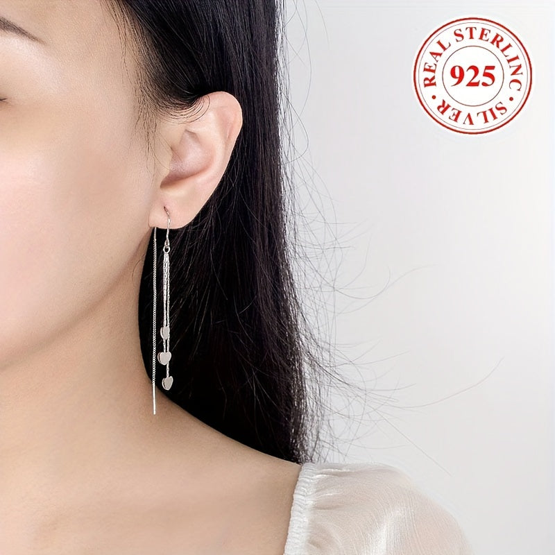 Elegant and simple, these glossy heart chain tassel dangle earrings are made of hypoallergenic sterling silver (925). The perfect delicate gift for a female, they will add a touch of elegance to any outfit.